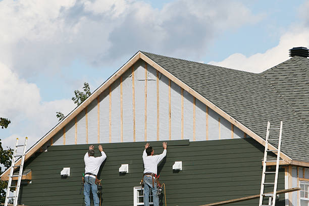 Professional Storm Damage Siding Repair technician working in Hustle, VA